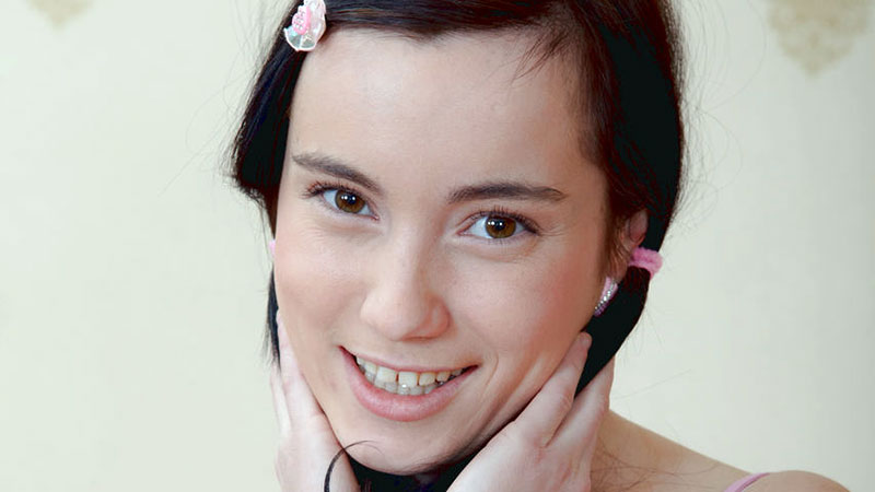  In this video, we have a pretty pigtailed teen with a nice pair of sm...